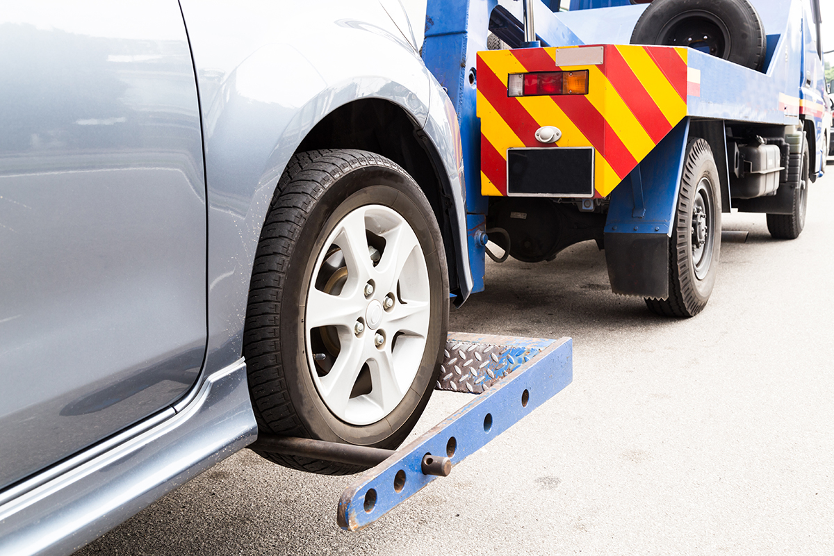 A tow truck pulling a car